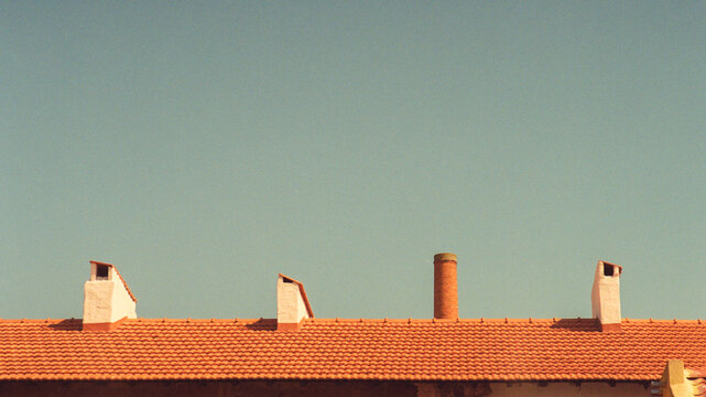 Rooftop Chimneys And Sky