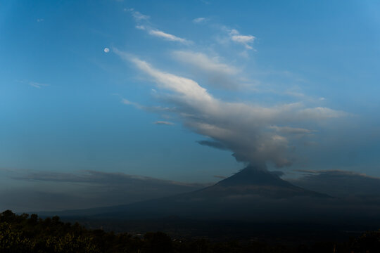 Popocatepetl volcano erupting during sunrise over puebla
