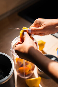 Preparing Fresh Fruit Ingredients for Homemade Smoothie
