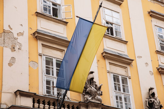 Budapest city hall facade and the ukrainian flag.