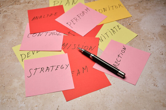 Sticky Notes and a Pen on a Table for Planning and Teamwork Ideas