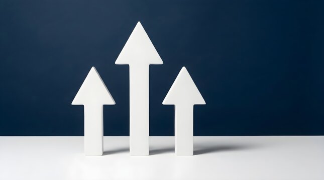 Three white paper arrows are pointing upwards symbolizing growth and success on a dark blue and light gray gradient background