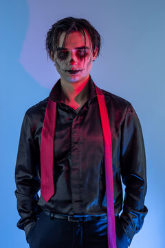 young guy with skull makeup celebrating a Halloween party