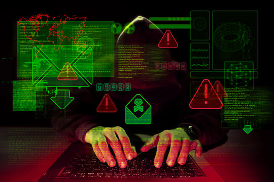 Faceless cybercriminal at keyboard with alert overlays and email envelope icons, representing phishing attack, malware delivery and online fraud