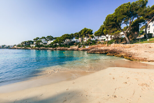 Quiet Cala Petita beach in Mallorca, Spain with clear water.