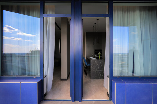 Large open glass doors in apartment