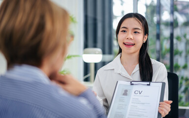Fototapeta premium Young Woman Job Interview Presentation Professional Resume Recruitment HR Manager Smiling Candidate Presentation Interview Tips Career Advice