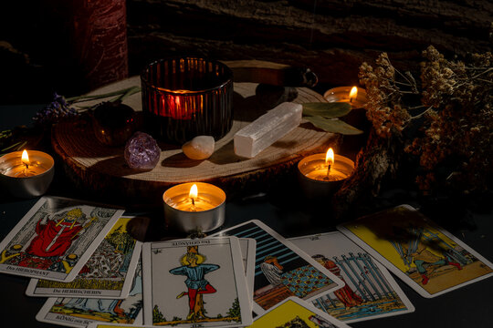 mystical tarot reading setting with candles and crystals creating a magical ambience at night