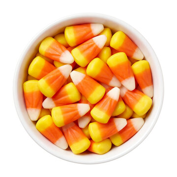 Candy corn filling a white bowl on transparent background