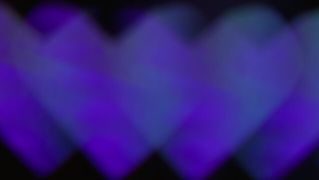 Blur geometric valentine. Love sign. Defocused neon blue green color shine heart lens flare spark glare flicker gleam on abstract dark black art background.
