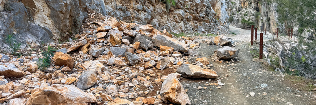 Rockfall on a mountain hiking trail with canyon scenery illustrating trail hazards and safety for outdoor editorial, travel blogs, risk management, social media