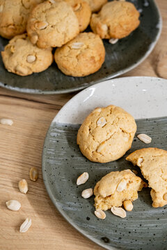 Crunchy biscuits. Home pastry. Baked cookies with peanut placed pile on wooden table. Healthy traditional dessert meal background.