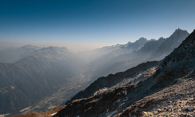 Obraz premium Chamonix Valley Top View From Tete Rousse Trekking Path With Aiguille Du Midi Visible High Altitude Alpine Landscape French Alps Mont Blanc Massif Hiking Trail Scenic Mountain Vista Outdoor Adventure