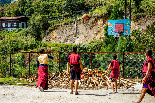 Bhutan,in Gantey, 
young  monks in the monastery of Gantey play Basketball