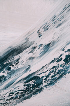 Canvas texture. Modern artwork. Abstraction with paint strokes with blue black gray color soft artistic mixing background.