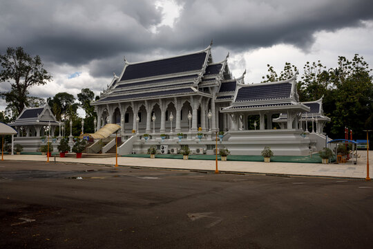 Wat Kaeo Korawaram white temple building under cloudy sky in Krabi, Thailand