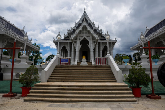 Wat Kaeo Korawaram white temple building under cloudy sky in Krabi, Thailand