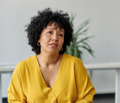 Group psychotherapy. Persons sitting in circle and talking. People meeting. Psychotherapy training, business lecture or conference. Man woman support group