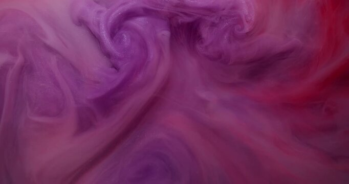 Mist ink splash. Smoke explosion. Shimmering cloud color spray flow liquid. Pink purple red fume abstract swirl blend defocused background.