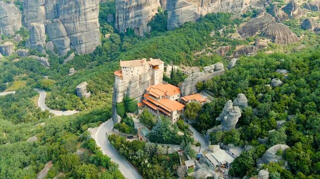 Meteora, Kalabaka, Greece. Holy Monastery of Rousanos - Saint Barbara. Meteora - rocks, up to 600 meters high. There are 6 active Greek Orthodox monasteries listed on the UNESCO list. Drone footage, 