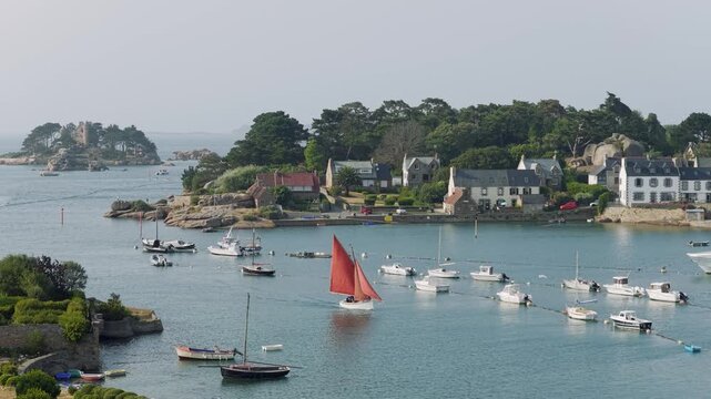 A scenic coastal view of the entrance to Ploumanac'h port in Perros-Guirec, Brittany, France.