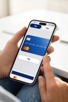 Visa payment card displayed on smartphone while hand presses Pay button, illustrating mobile banking, digital commerce, secure transaction technology services.