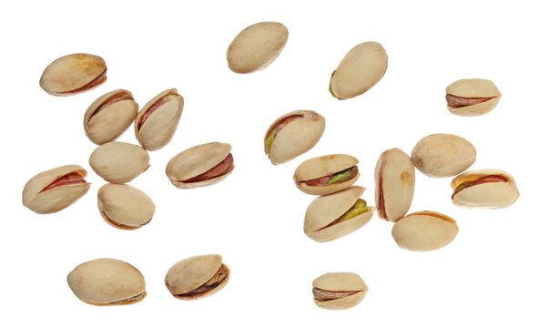 Pistachios pile flying, isolated on white background, clipping path