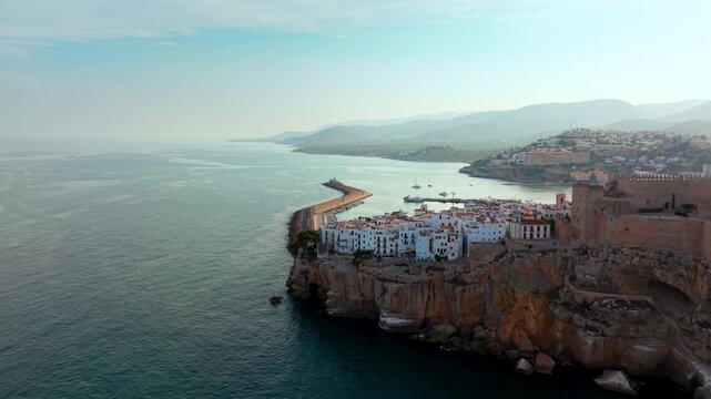 Aerial view of Peniscola castle and port, Mediterranean sea, Castellon, Spain. High quality 4k footage