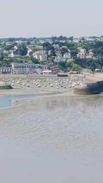 A sweeping aerial view of Binic, a picturesque coastal town in Brittany, France.