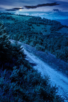 hiking path in carpathian mountains at night. full moon over alpine nature of transcarpathia in summer. ukraine mountain landscape for travel. views of borzhava ridge. mysterious fantasy