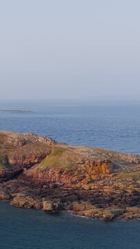 Aerial view of the rugged rocky coastline of Ilot Saint Michel near Erquy in Brittany, France.