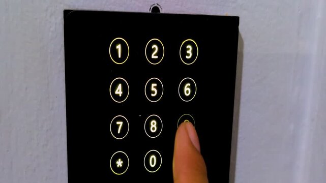 Closeup of finger touching a secure keypad to enter password code and unlock access through security dial lock, enabling secure authentication and protected entry for modern protection and privacy.