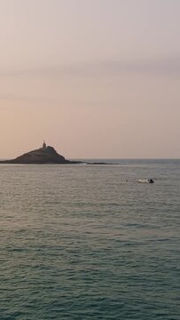 Wide shot of Ilot Saint Michel with its chapel off the coast of Erquy, Brittany, France.