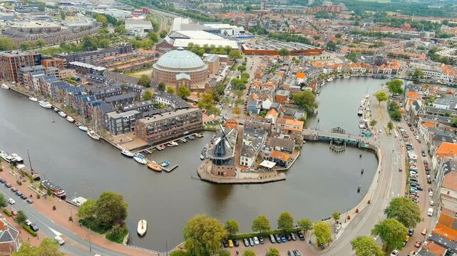 Haarlem, Netherlands. Windmill De Adriaan (1779). Windmill from the 18th century. Panoramic view of Haarlem city center. Cloudy weather during the day. Summer. Drone footage, Point of interest