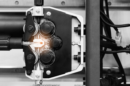 Part of modern welding machine with wire feeder for welding, tech industrial technology background