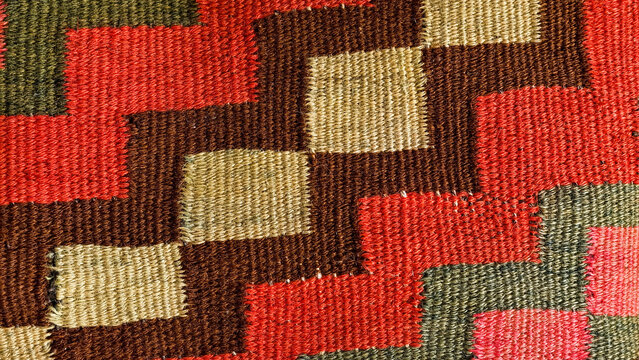 Hand woven kilim rug featuring traditional folk art patterns and intricate geometric motifs, showcasing detailed textile texture, cultural craftsmanship, and vibrant design