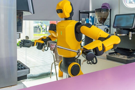 Humanoid robot prepares coffee using automatic coffee machine in Shenzhen, China. Artificial intelligence, robotics, service automation, smart hospitality, future food service technology