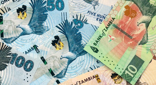 Zambian kwacha money bills in pile on table. Zambia ZMW currency cash close up
