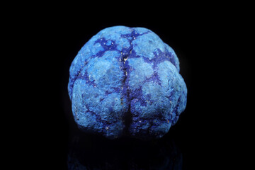 Fototapeta premium Bright blue crystal Azurite displayed on a dark surface in a close-up view showcasing its unique patterns