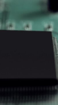 Close up of a green circuit board with a sutil 3D camera move 1080 x 1920 social ready