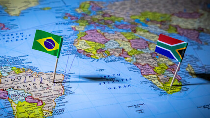 Close up of Brazil and South Africa flags on map showing global connection. © Photo Agency