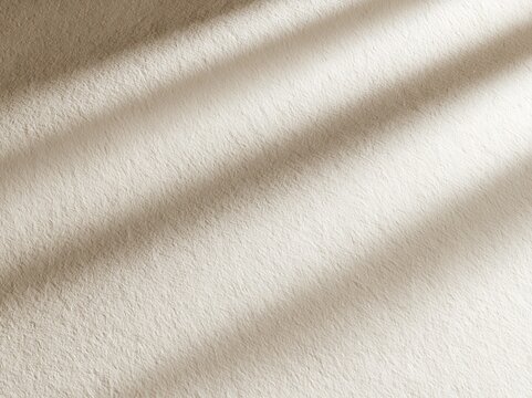 Soft Beige Fabric Background with Sunlight Shadows and Texture Detail