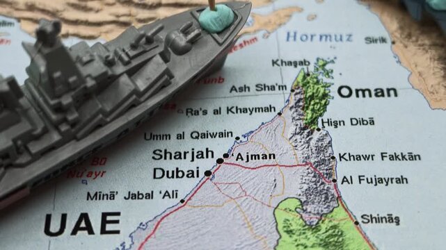 Conceptual representation of the US army emptying its arsenal and facing a stockpile crisis during a potential war in the Strait of Hormuz, with miniature military vehicles on a map of Iran