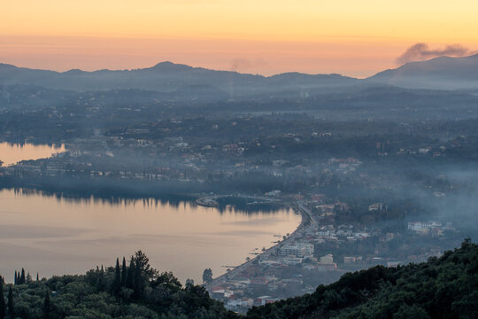 Serene Sunset Over Ipsos Bay, Corfu: Majestic Mountain Views and Tranquil Ionian Sea Landscape in Greece