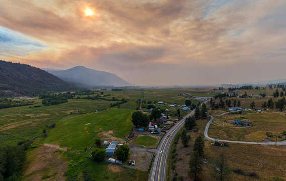 Aerial View of Rural Valley With Wildfire Smoke Over Merritt British Columbia, Canada at Sunset