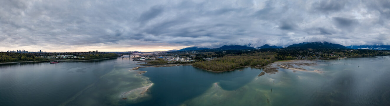 Aerial Panoramic View Over Burrard Inlet and Vancouver Skyline With Mountains and Shoreline