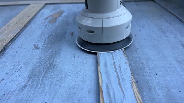 Close-up 4K shot of sanding wooden surface with power sander &ndash; woodworking renovation and DIY project footage