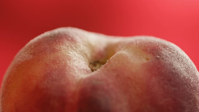Nectarine or peach fruit, fresh Spanish red nectarine, peaches stacked on wooden table with red background