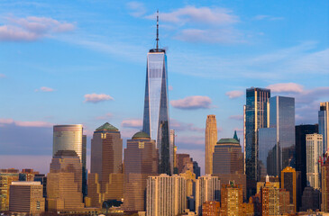 Obraz premium New York City skyline with iconic Manhattan towers. NYC Manhattan cityscape with blue sky. Manhattan aerial view in New York City. New York downtown skyline.