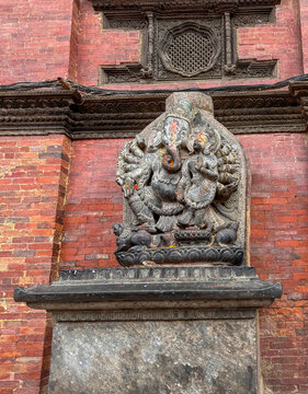Stone sculpture depicts the Hindu god Ganesha next to his consort, Siddhi, at Patan Durbar Square in Lalitur, Nepal